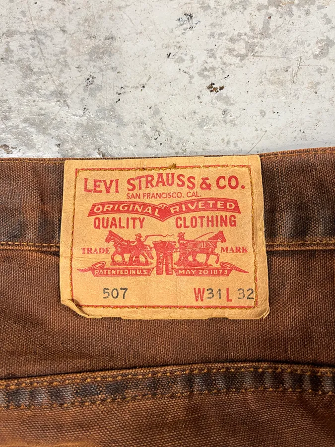 2000s Levi’s 507 Coated Faded Denim Brut Jeans - Image 9